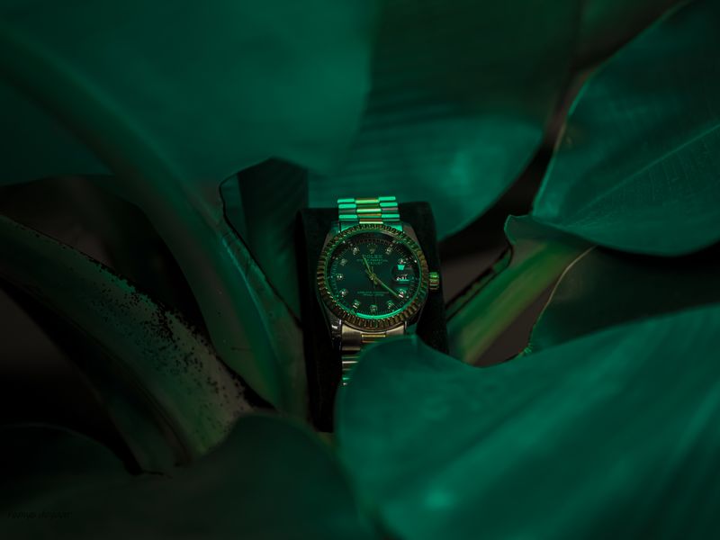 Luxury chronograph watch with a vivid green dial