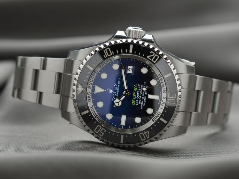 Gold Rolex Submariner with a deep blue diamond-set dial